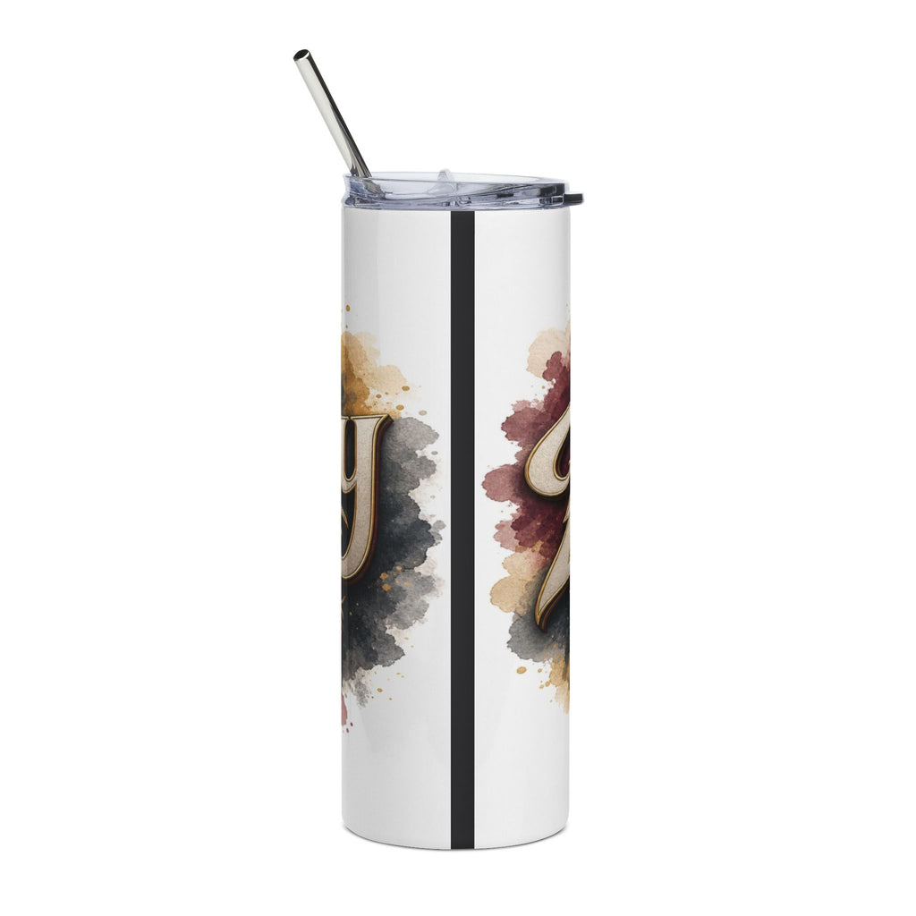 White tumbler with metallic straw and watercolor splatters on either side of a dark stripe.