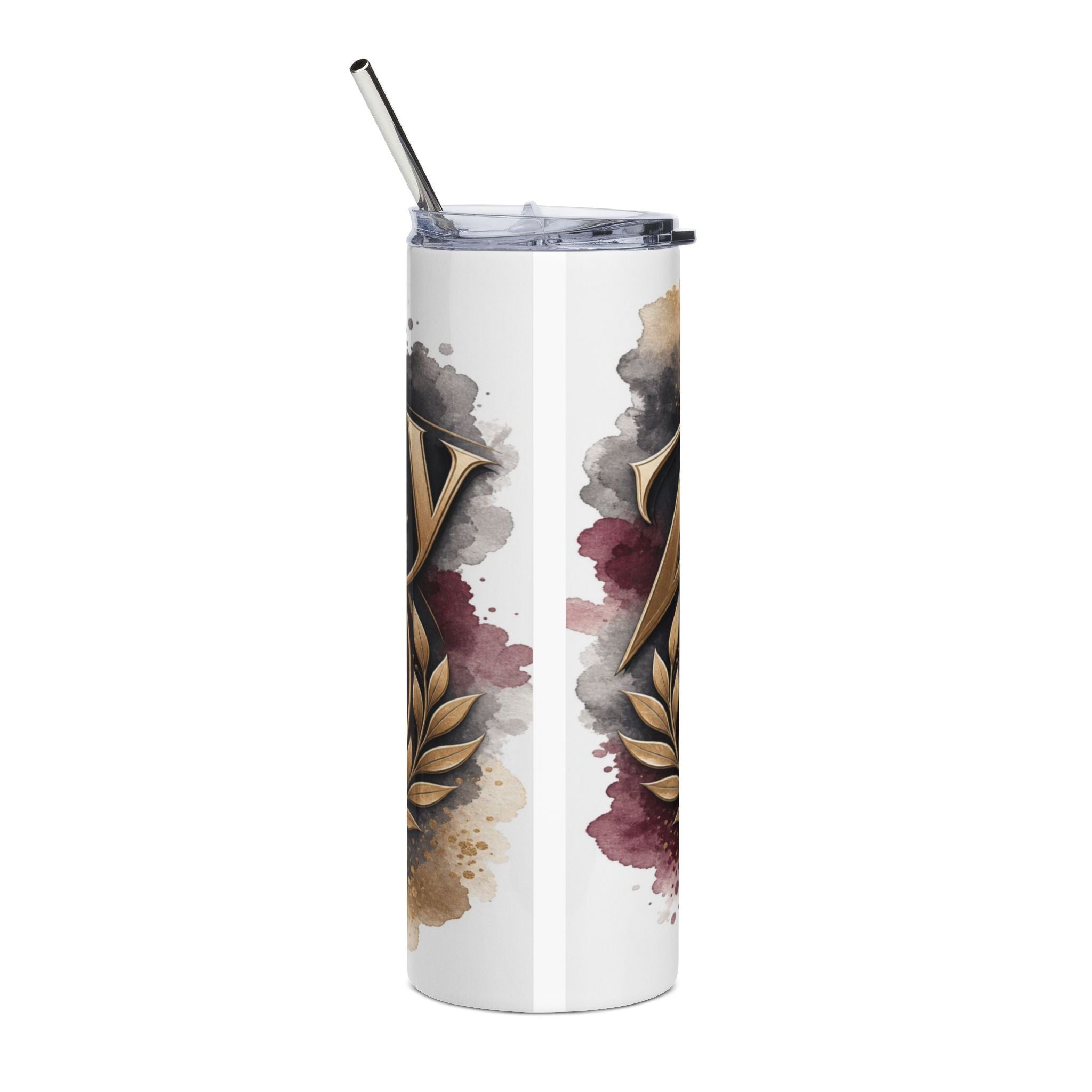 White tumbler with gold ornate letter V and watercolor splatters.