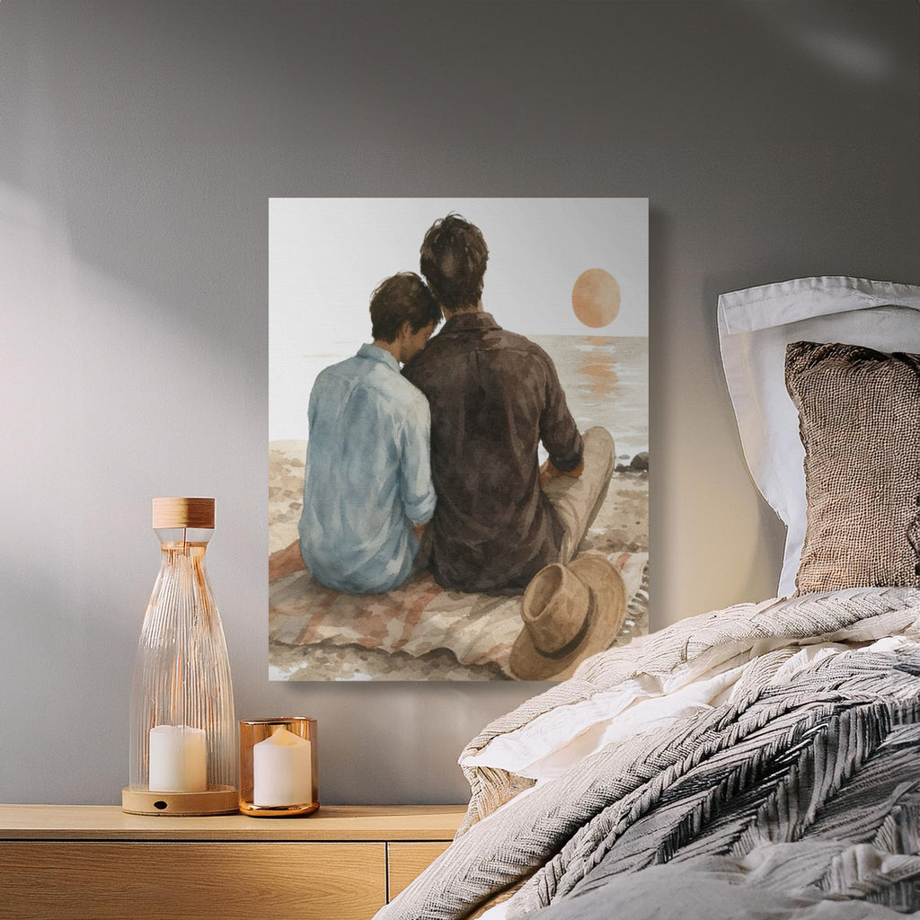 Two figures sit on a blanket at the beach watching a tranquil sunset over the water.