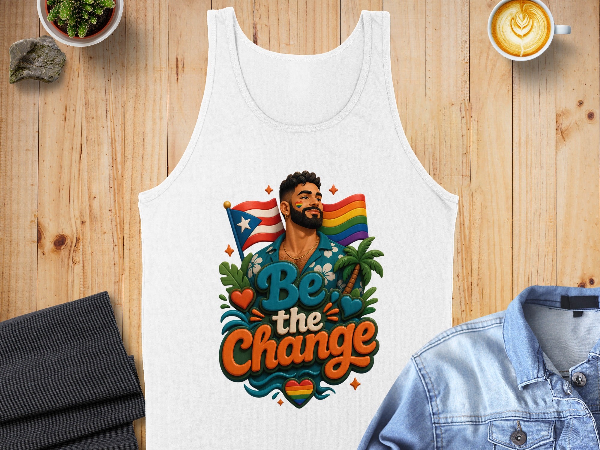 White tank top with "Be The Change" text, LGBTQ+ flag, and tropical imagery.