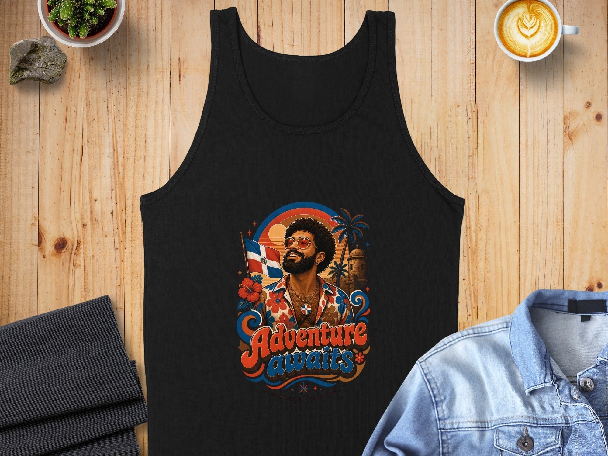 Black tank top with colorful "Adventure Awaits" graphic featuring a person waving a Dominican Republic flag.