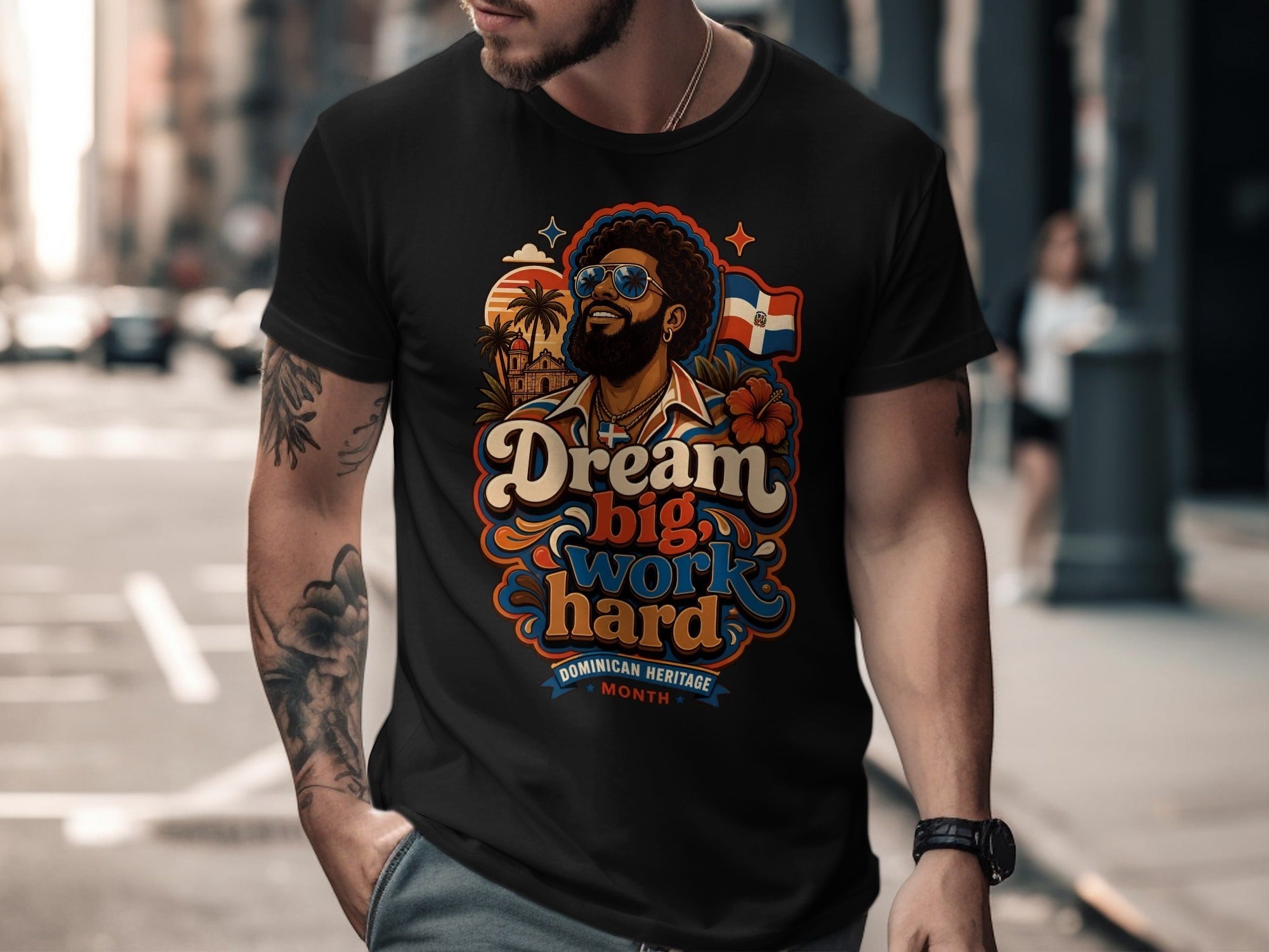 Man in t-shirt with "Dream big, work hard" text and Dominican flag.