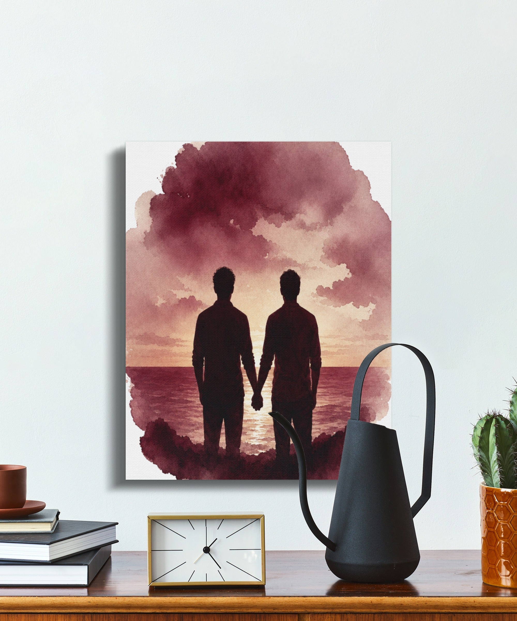 Framed watercolor art print of two men holding hands at sunset over water.
