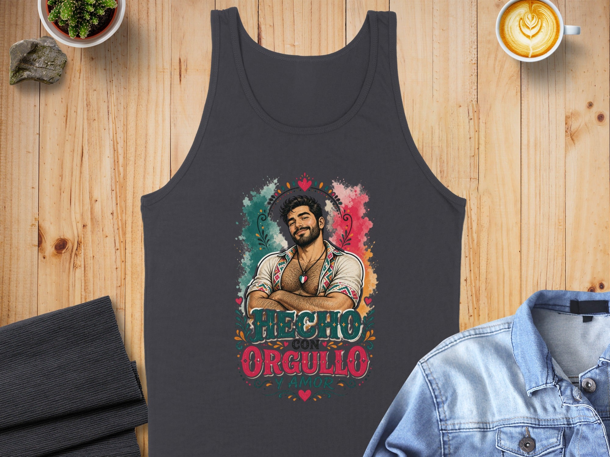 Dark gray tank top with man illustration and "Hecho con orgullo" text.
