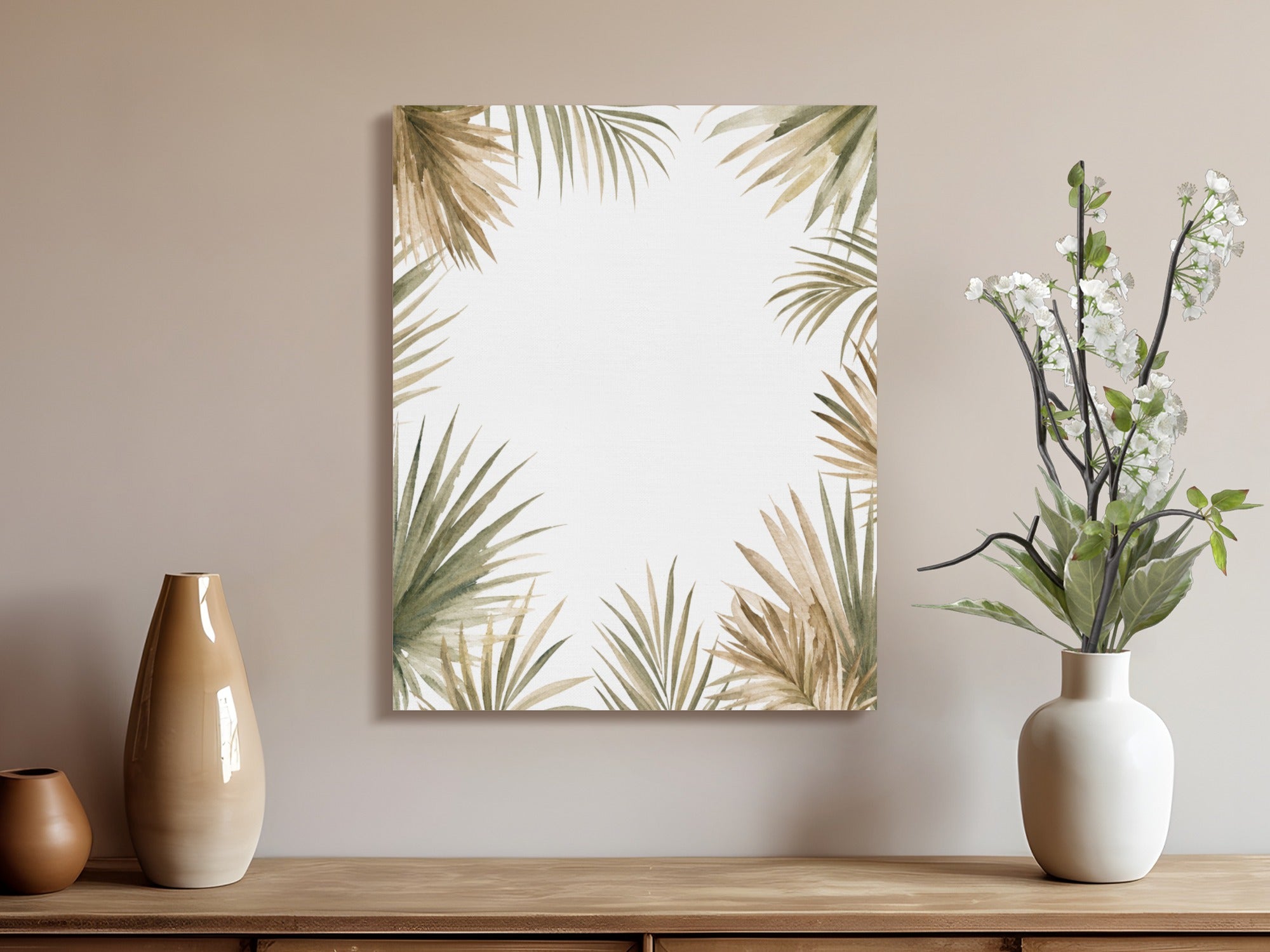 Artwork with palm leaf border next to a white vase with white flowers and brown vases.