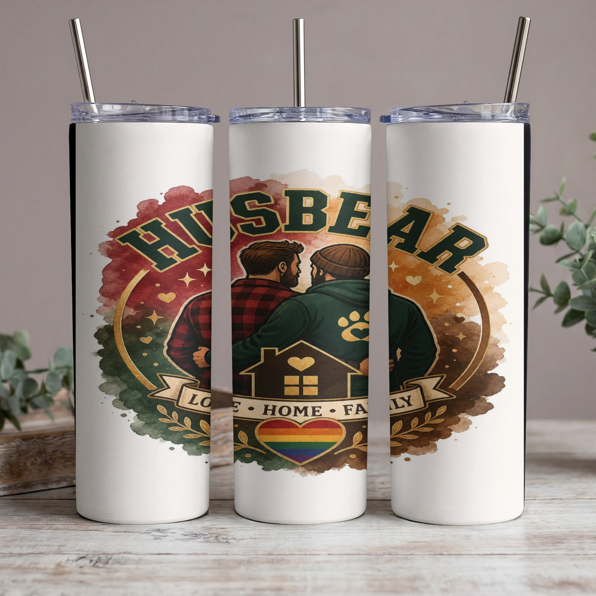 Husbear graphic on white tumblers with rainbow heart, house, and family text.