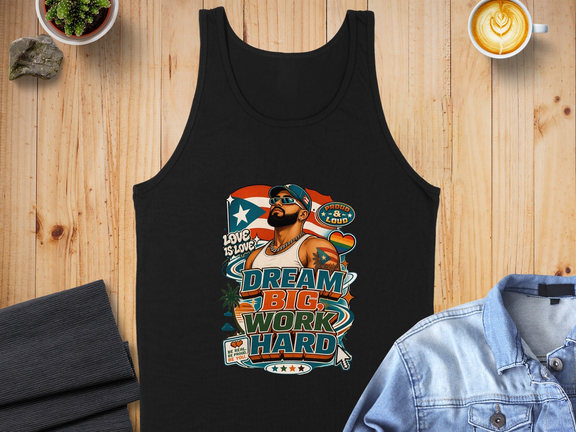 Black tank top with "Dream Big, Work Hard" slogan, LGBTQ+ pride, and diverse figures.