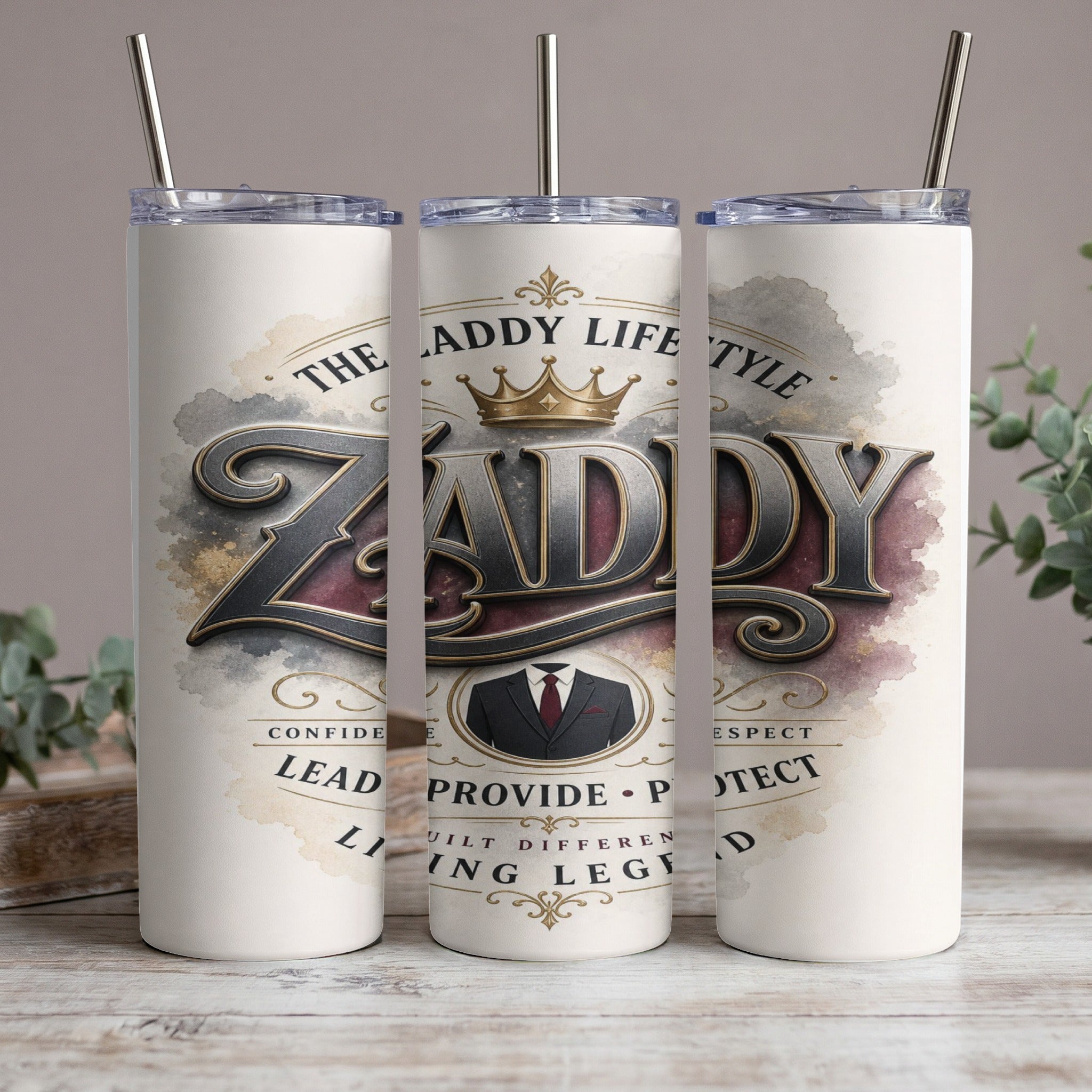 White tumbler with "ZADDY" in large metallic font, crown, suit, and words.