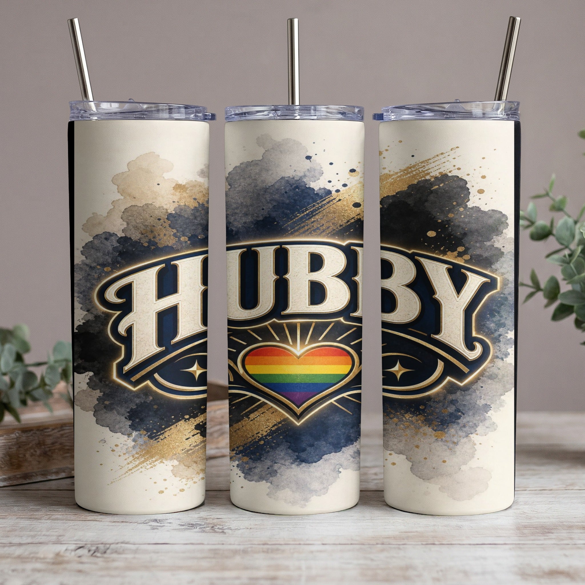 Three tumblers with "HUBBY" text and a rainbow heart graphic on a neutral background.
