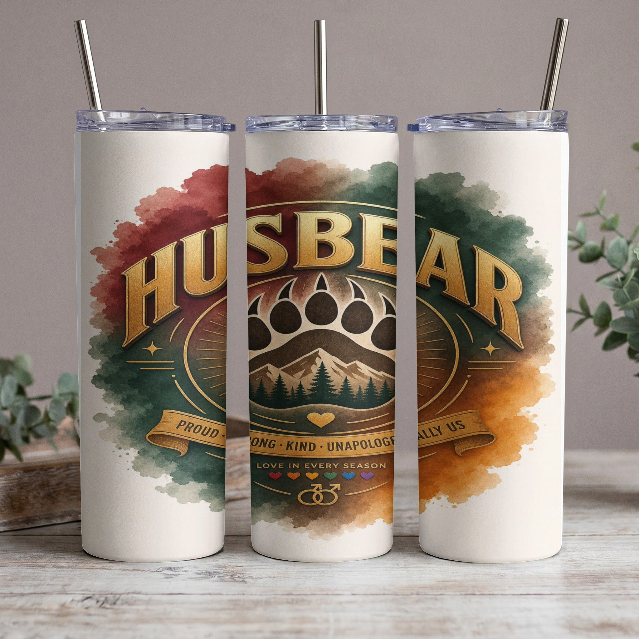 "HUSBEAR" tumbler with bear paw, mountains, and pride symbols.