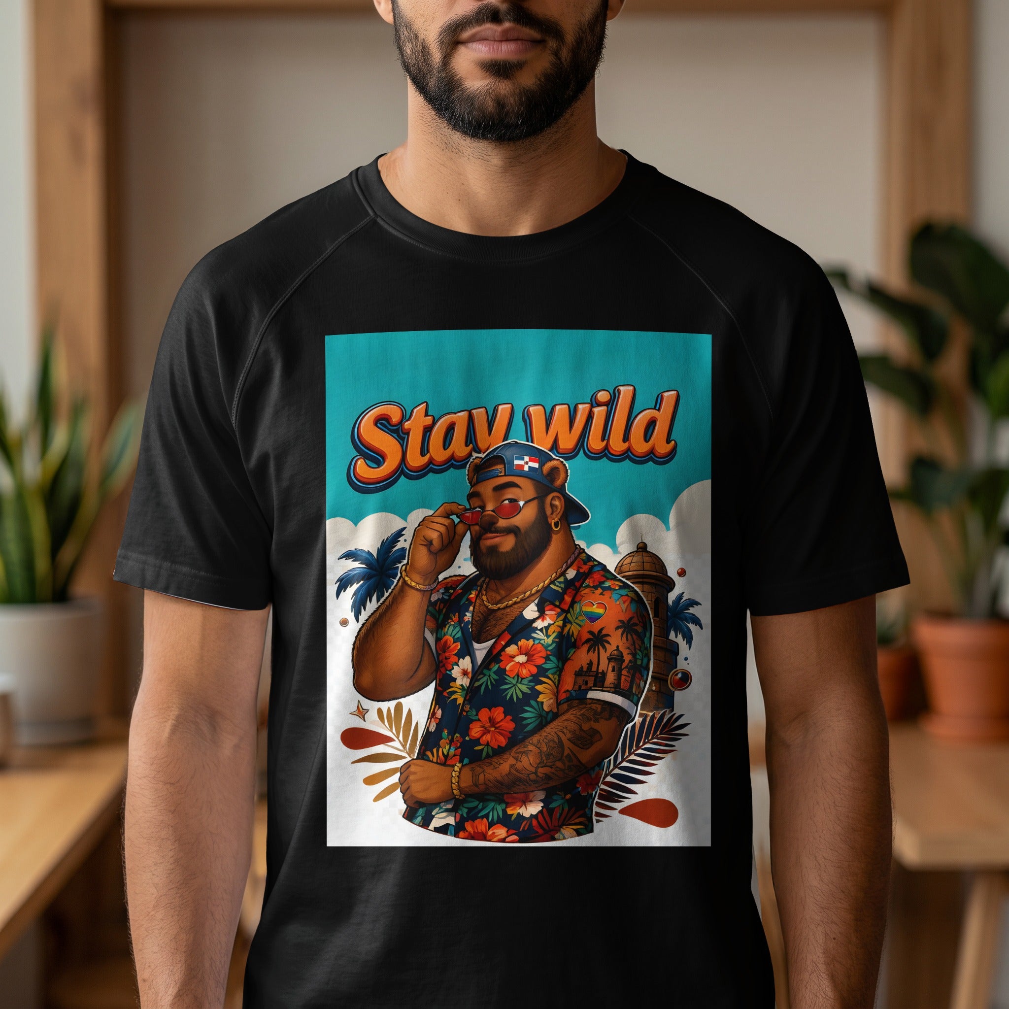 Man in black t-shirt wearing a Hawaiian shirt with "Stay Wild" text design.