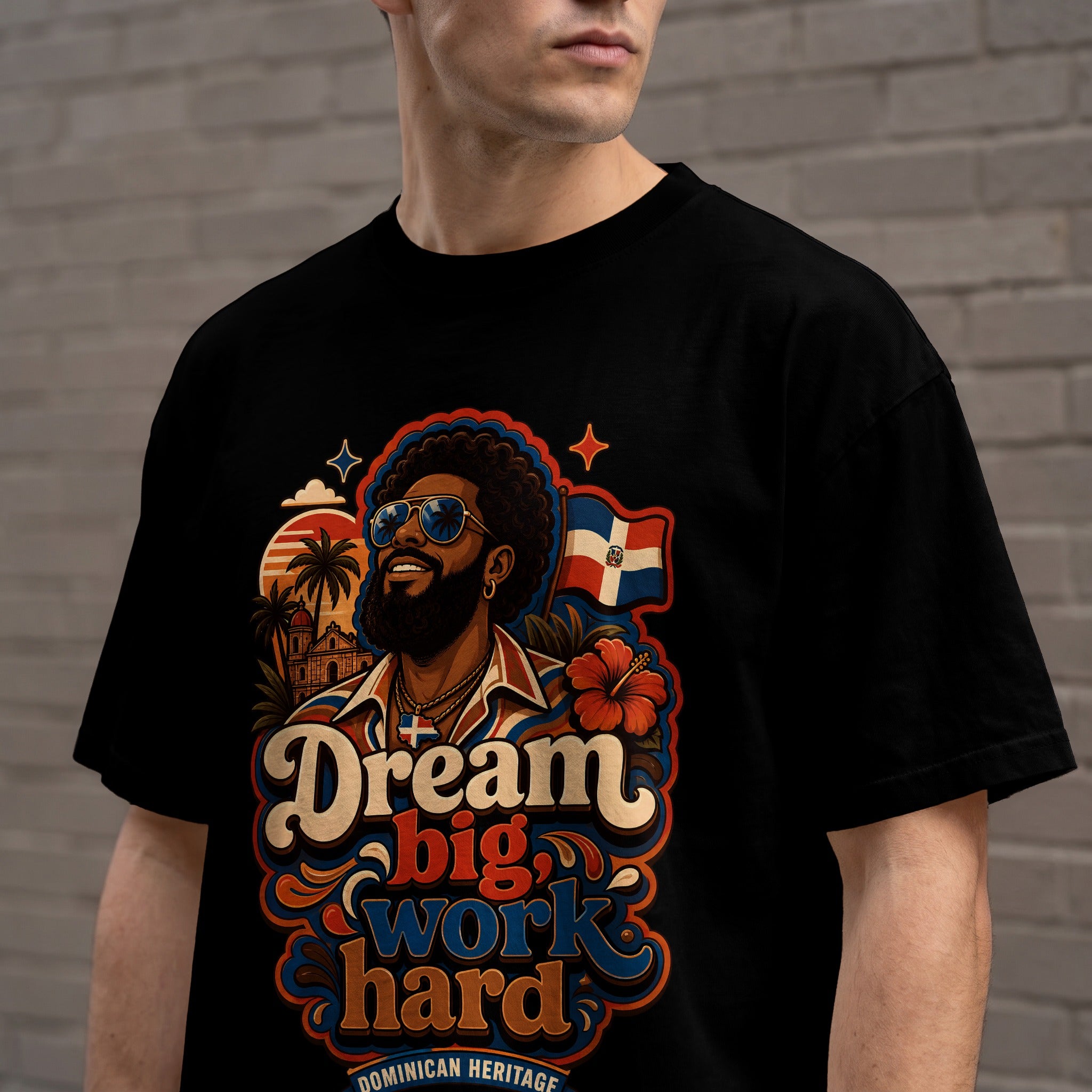 Black t-shirt featuring a graphic of a man with "Dream Big, Work Hard" text.