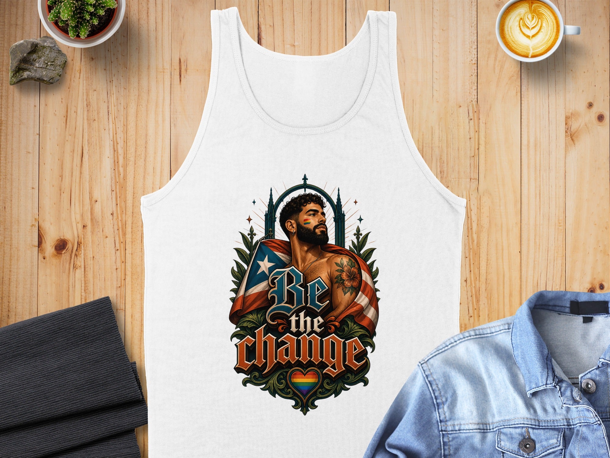 White tank top with "Be the Change" text and a colorful Puerto Rican flag graphic.