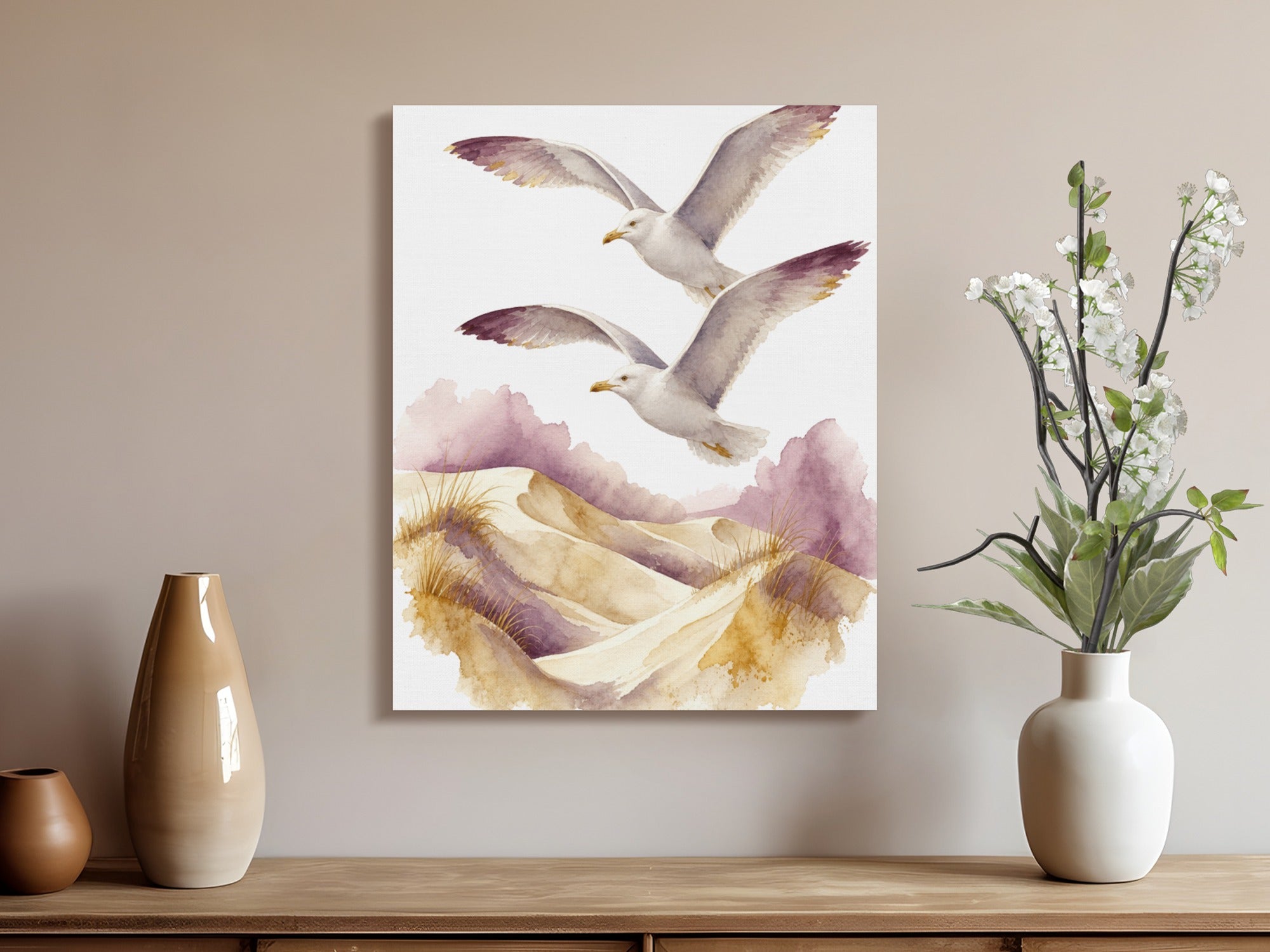 Watercolor painting of two seagulls flying over sand dunes with purple accents.