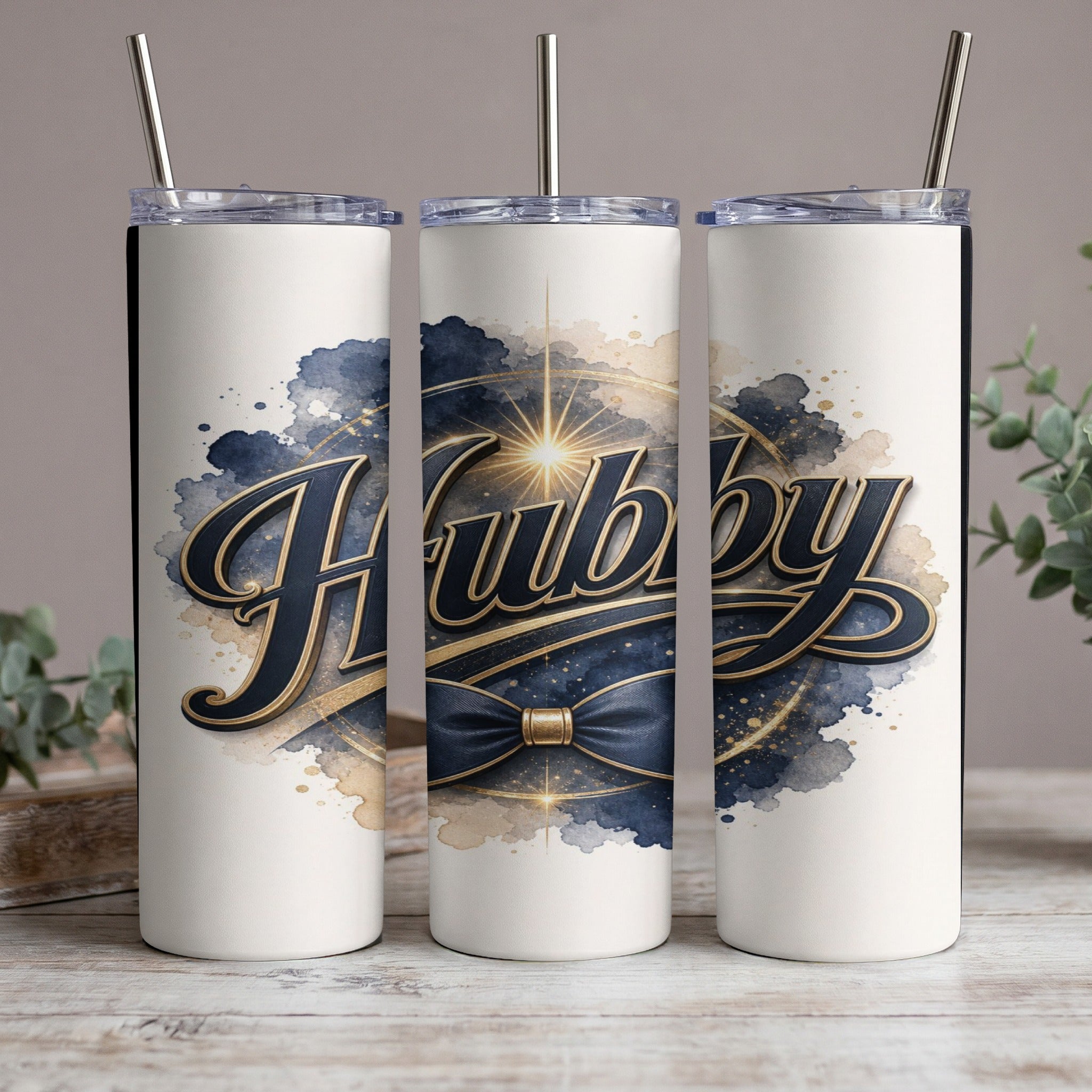 Three tumblers with the word "Hubby" in gold and navy lettering.