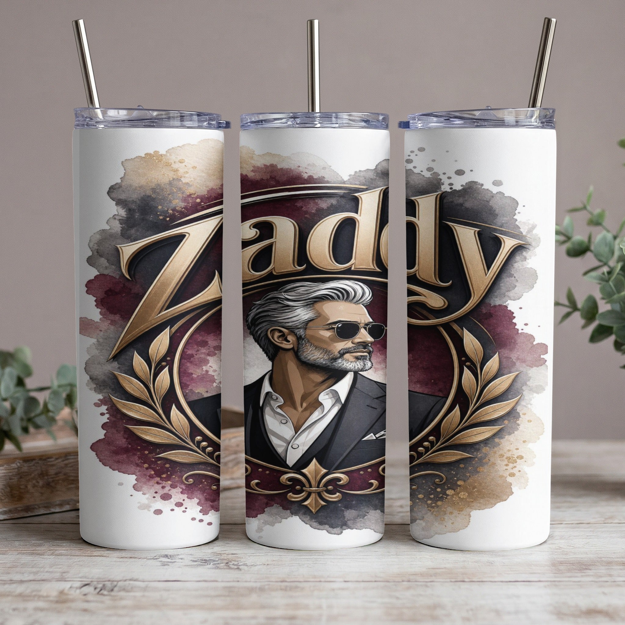 White tumbler with "Zaddy" text, a distinguished man in sunglasses, and ornate gold leaf details.