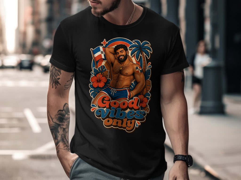 Black t-shirt with a design of a muscular man, palm tree, hibiscus, and text "Good Vibes Only".