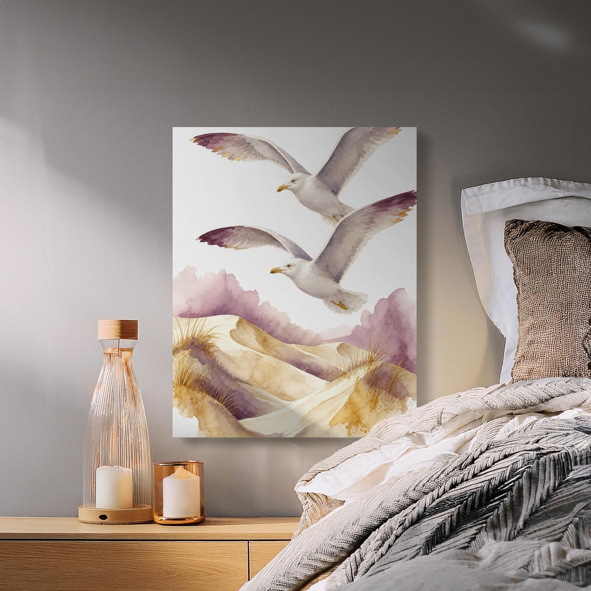 Watercolor painting of two seagulls flying over sand dunes with purple accents.