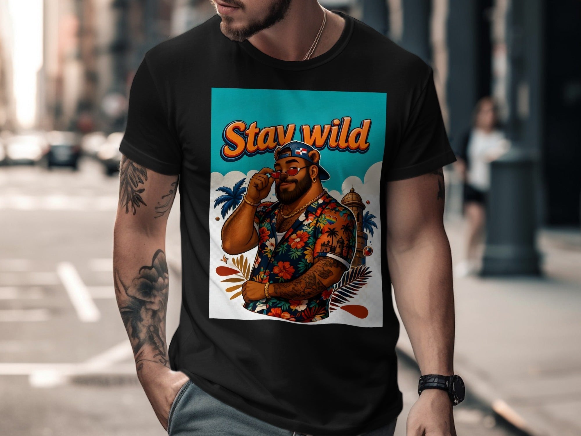 Man wearing a black t-shirt with "Stay Wild" graphic and floral shirt.