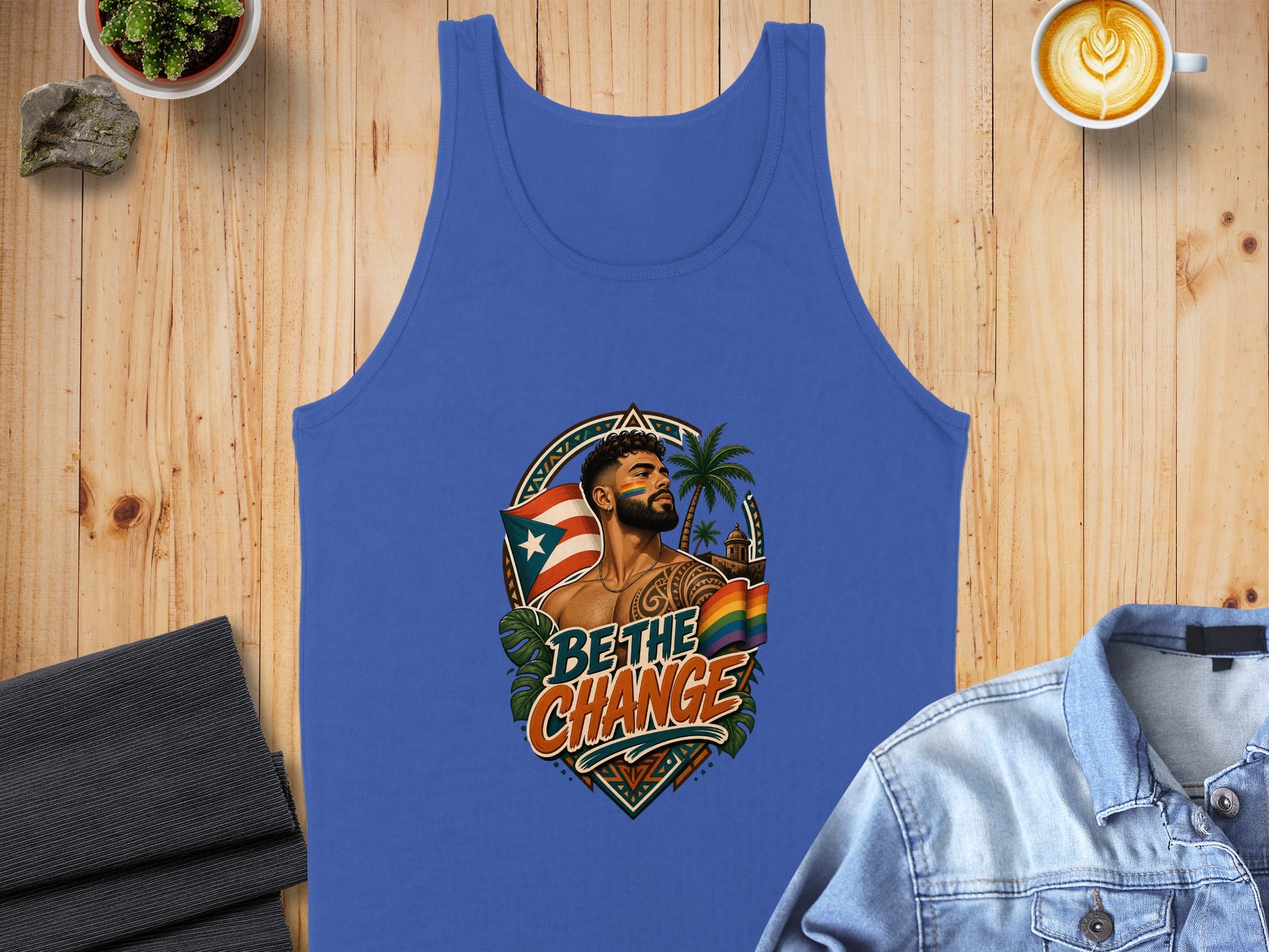 Blue tank top featuring a man with Puerto Rican flag tattoo and rainbow border design.