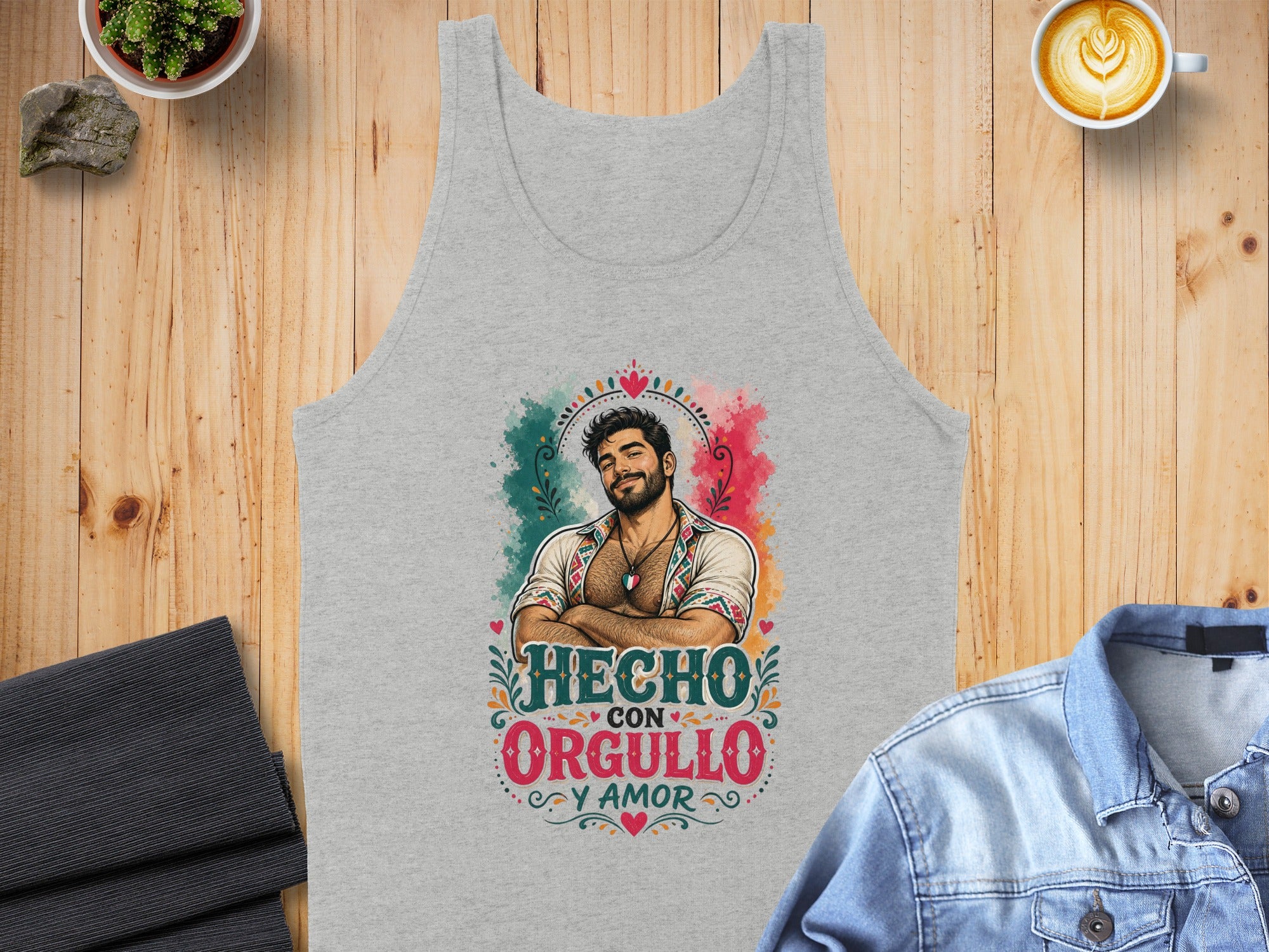 Grey tank top with colorful graphic of man and "Hecho con orgullo y amor" text.