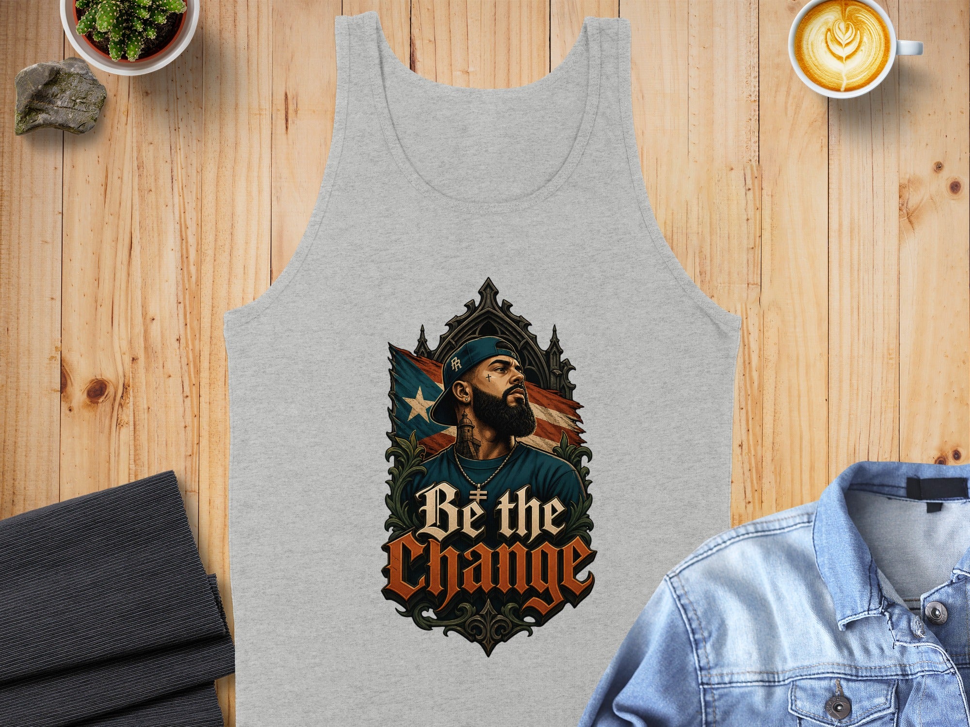 Gray tank top with "Be the Change" text and a portrait of a man.