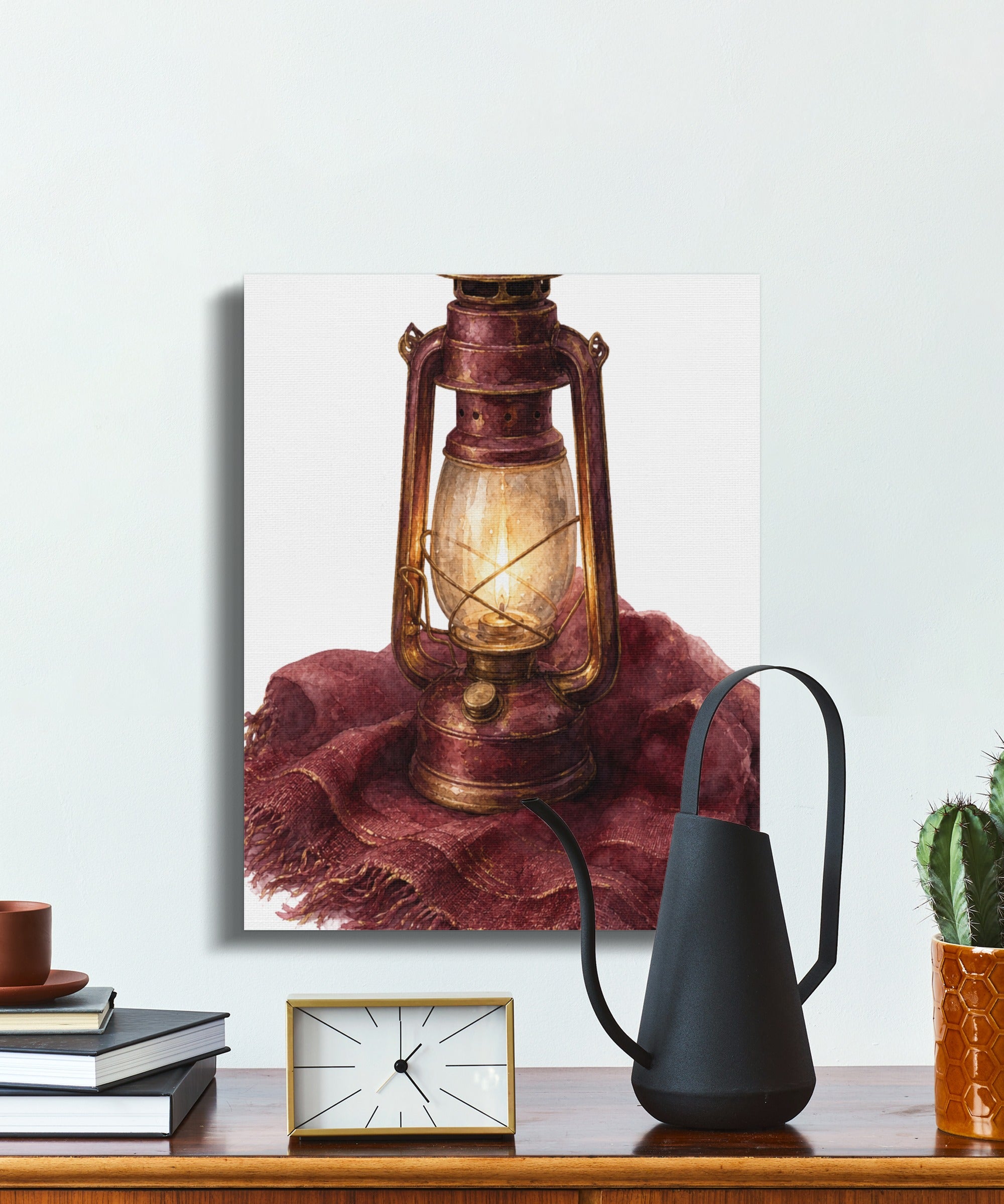 Watercolor painting of a vintage red lantern on a burgundy shawl.
