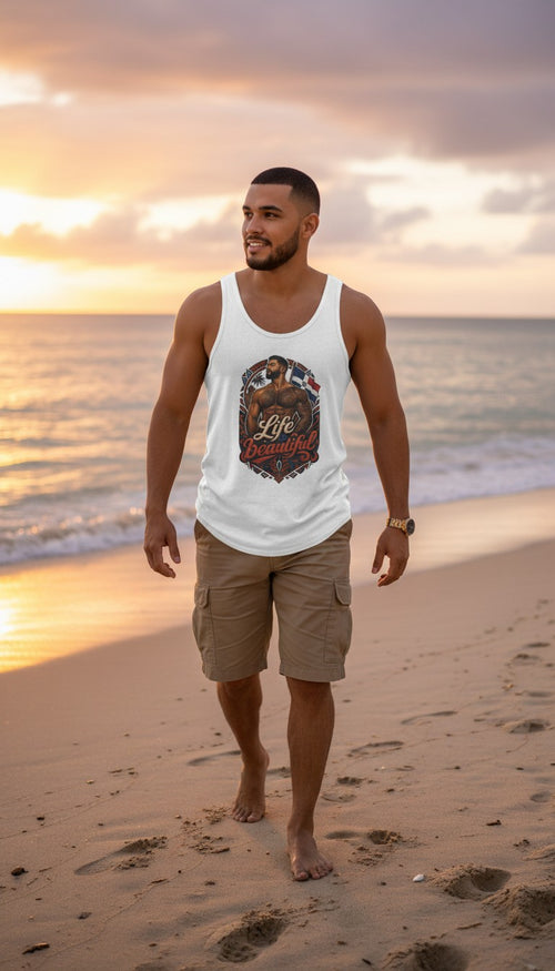 Oso Caribeño white cotton tank top with Dominican pride Life is Beautiful graphic worn by a man on a beach at sunset