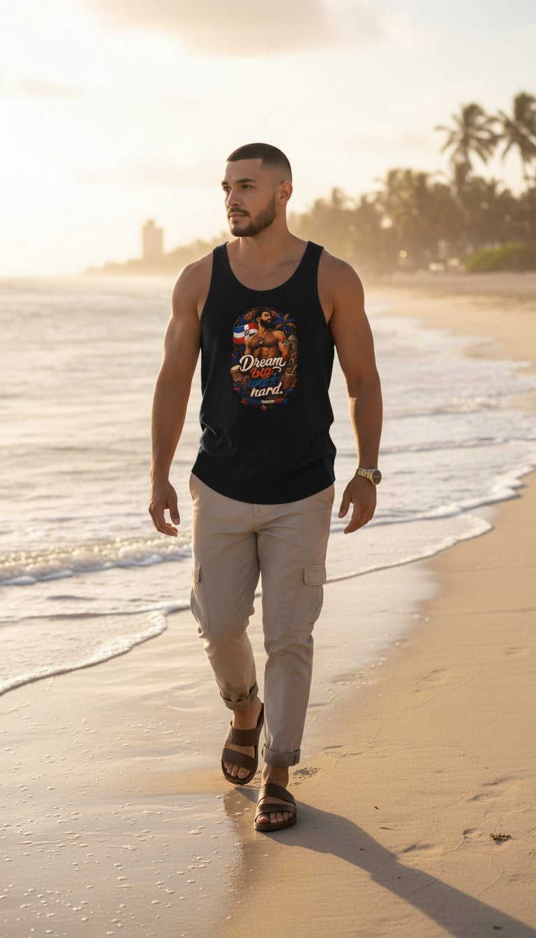 Oso Caribeño black tank top featuring Dream Big Work Hard graphic on a man walking on a tropical beach at sunset