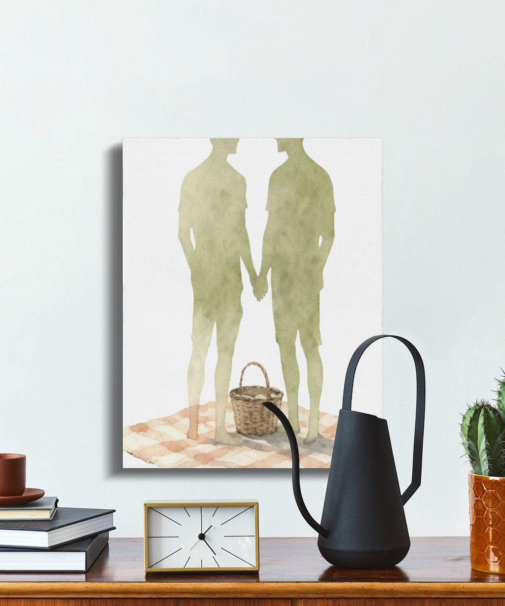 Oso Caribeño watercolor canvas print featuring two men holding hands at a picnic, displayed on a white wall.