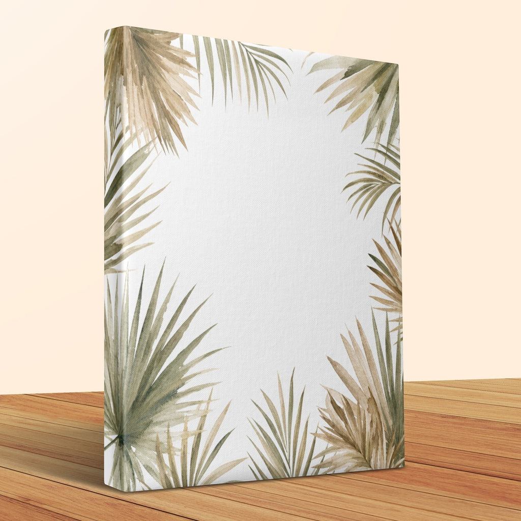 Oso Caribeño watercolor palm frond canvas print with earthy green and beige tones on a wooden surface.